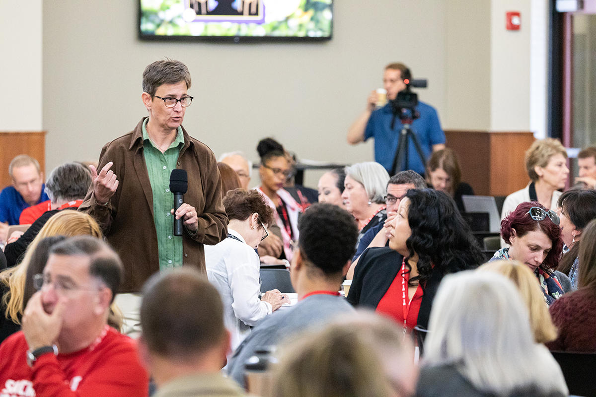 Member asking a question at a convening